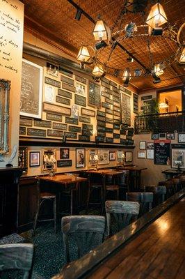 Interior wall of signatures at Newsroom Pub