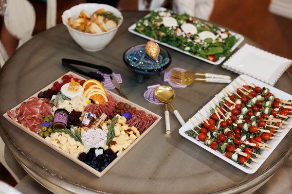 Cheese board, caprese skewers, salad