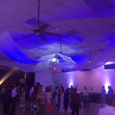 This is our latest work.  We provided draping over the dance floor and uplights around the room to take Catherine's event to ...