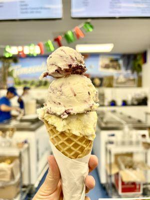 Banana cream pie & blueberry cobbler ice cream in a waffle cone