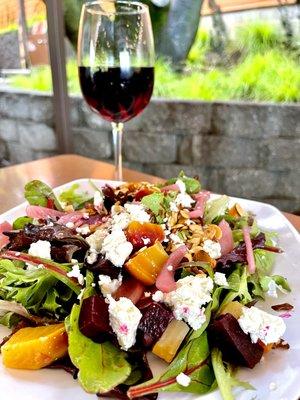 Golden and red beet salad with goat cheese, pickled onions, toasted almonds, with a balsamic dressing