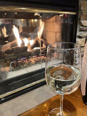 Glass of wine by the cozy fire at the Dunraven before retiring to our room