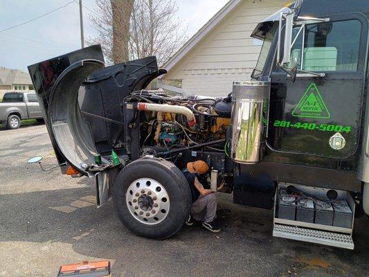 Kaytlyn rabbitt repairing septic pump truck