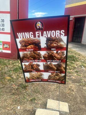 Wing flavors menu next to menu board