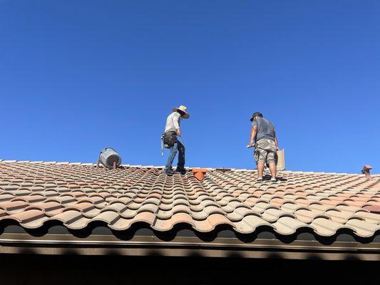 After underlayment, few tiles, and vent were replaced and tiles were laid back in place.