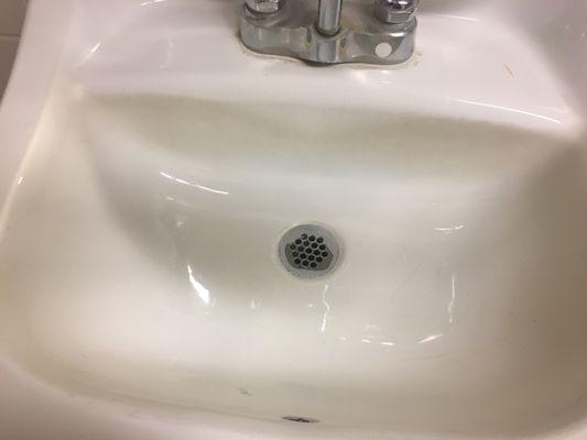 Sink had a dark sick stain.