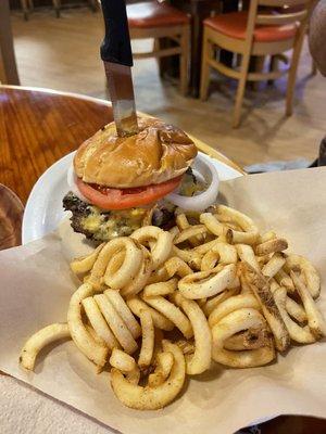 BYOB burger with curly fries (onions and tomatoes with mustard and mayonnaise)