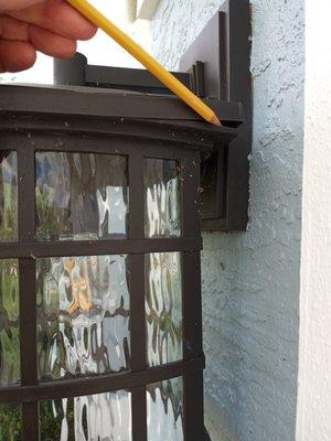 Gap between lid and body of garage light.