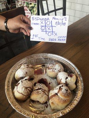 Non-Garlic Knots with Powdered Sugar and Blueberry Jelly