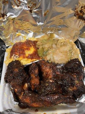 Whole barbecued wings, cabbage, macaroni and cheese.