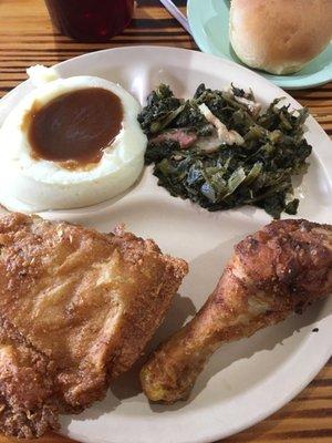 Fried chicken, greens and mashed potatoes.