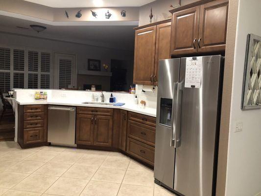 The sink, food prep area, and bar top.