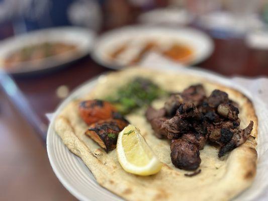 Lamb kabob on naan bread