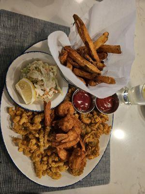 Seafood platter   Clama, oysters,  shrimp, fries, and coleslaw