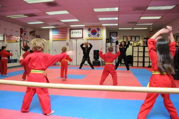 Master Doug and Ms Anita lead the class in some cardio