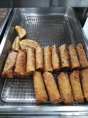 Home made egg rolls-pork+ veggies, made here in our kitchen.