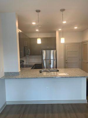 View of the kitchen on one of the pine 25 Floor Plans.  Appliances are stainless steel.