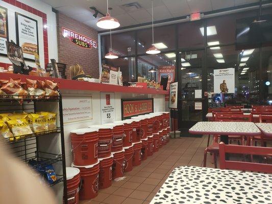 You can see the female employee right below the Firehouse Subs sign. I saw her hop up, then down off the counter.