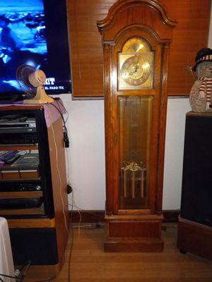 This Clock is a Howard Miller cost $1000 bought in 2000, height is 6' 5"