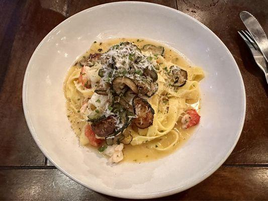 Tagliatelle in butter sauce with lobster, zucchini, and parmigiano