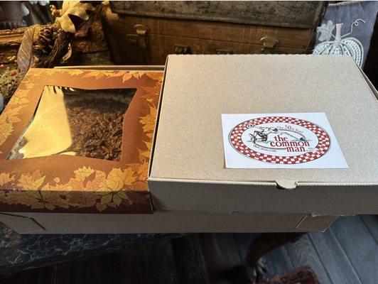 Boxed meal in sturdy perfectly sized boxes (two boxes, including box on the bottom, box on top right and extra pie on the left)