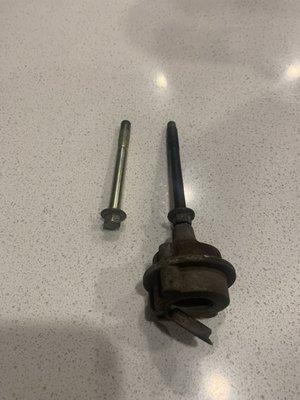 Brake caliper bolts.  Correct on the right, wrong on the left.