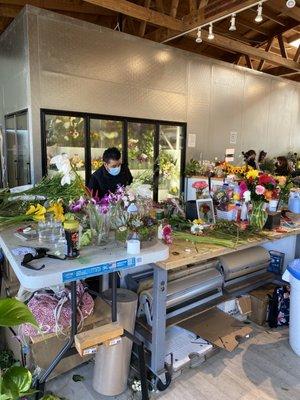 A SHOP FULL OF ARTISAN FLORISTS WITH SEEMINGLY LIMITLESS ACCESS TO PRIME FRESH CUT BLOOMS.