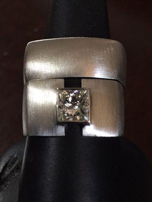 Contemporary white gold wedding set holding a 1ct. square diamond