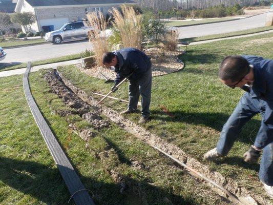 Yard drainage system installation.