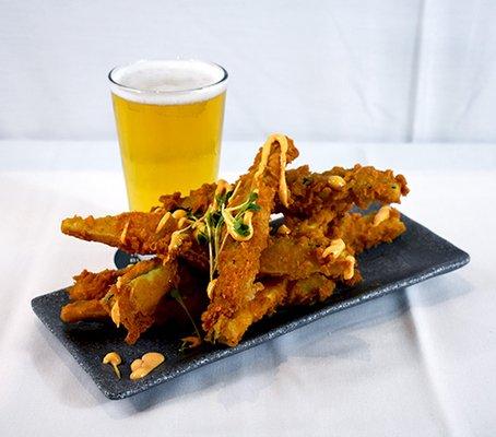 Fried zucchini sticks and a draft beer