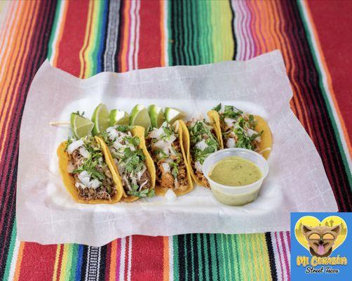 Taco Mix, beef asada and chicken fajita street tacos, topped with onions, cheese & cilantro. Limes and salsa verde on the side.