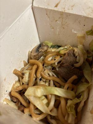 Udon noodles with cabbage, mushrooms, zucchini, mung, bean, sprouts, beef, and chicken with a teriyaki sauce