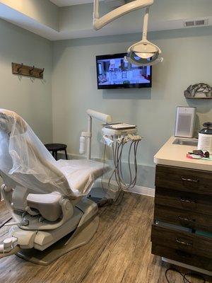 Exam room: Medify air purifier, plastic covers entire dental chair, and complete sanitation of room.