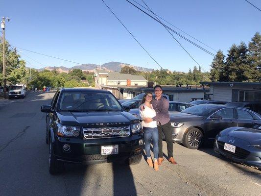 Happy customers with their 2013 Land Rover LR2 HSE