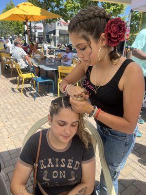 At the Castro Valley car show , promoting La Bella Salon. 
With free braiding .