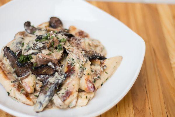 Wild Mushroom Gnocchi, hand cut ricotta gnocchi, garlic cream, wild mushrooms