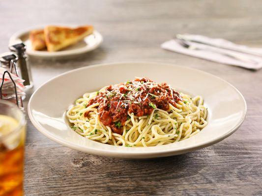 A generous portion of pasta topped with our hearty meat sauce with the perfect blend of seasonings, served with garlic toast.