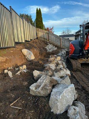 Boulder wall construction.