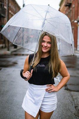 This pre-loved top is embroidered with the saying, "No rain, no flowers."