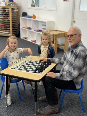 Mr. Daniel, the school owner, teaching chess during aftercare