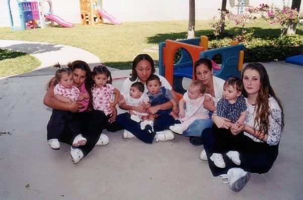 Mothers and children on playground.