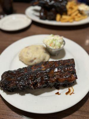 1/2 rack Baby Back Ribs. Mashed potatoes, coleslaw