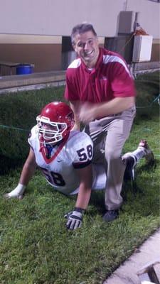 Dr Fulkman helping a Clear Lake Player on the sidelines.