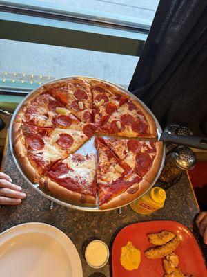 Pepperoni pizza with some pineapple from our salad