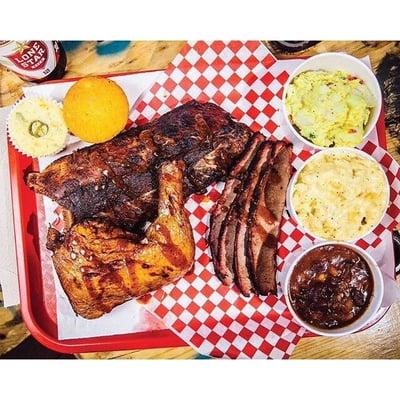 Baby back ribs, brisket and chicken, with corn bread, sides and Lone Star!