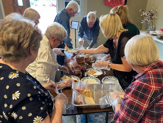 Sandwich creation station for Good Friday lunches for the Unhoused.