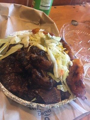 Up close and personal small Oxtails, Cabbage, Rice & Peas with Plantains. Delicious!