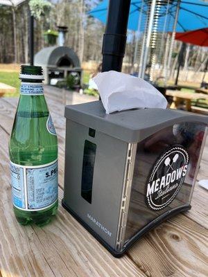 Picnic table. Portable pizza oven in back