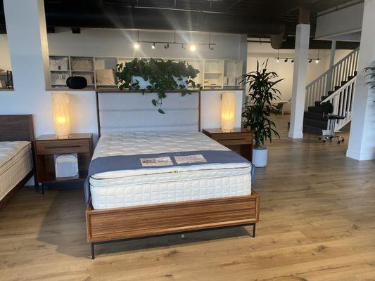 Naturepedic Organic EOS Pillow-Top displayed with bamboo bed frame