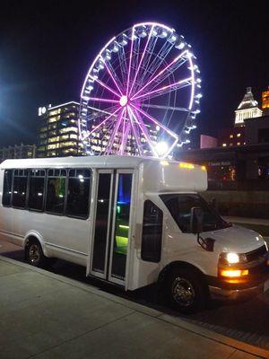 This is our new white party bus named Casper. Obviously downtown Cincinnati in front of the SkyWheel